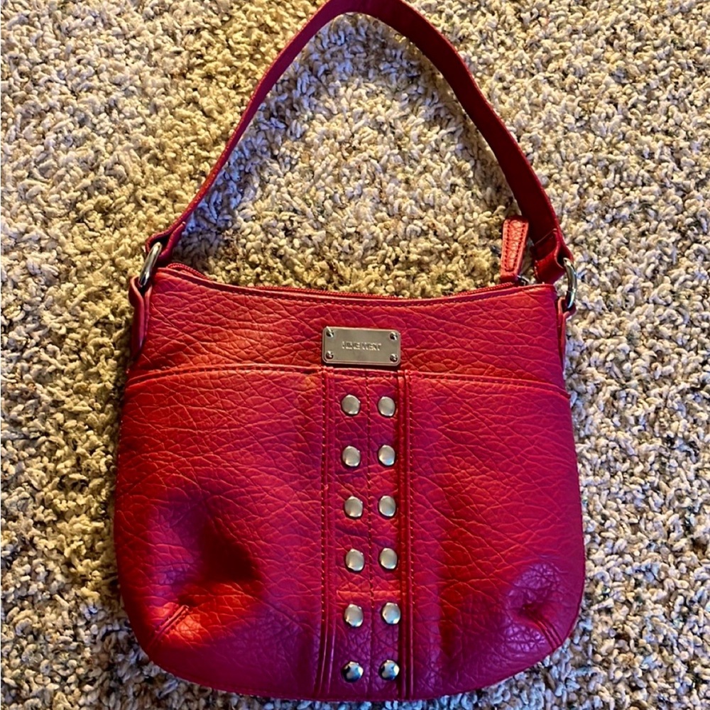 Red Nine West Faux Leather Small purse with Silver accent details.